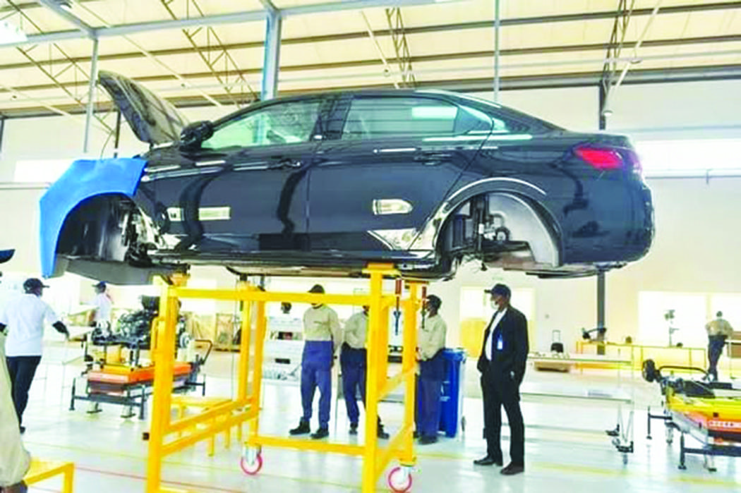 African technicians assembling a complete car