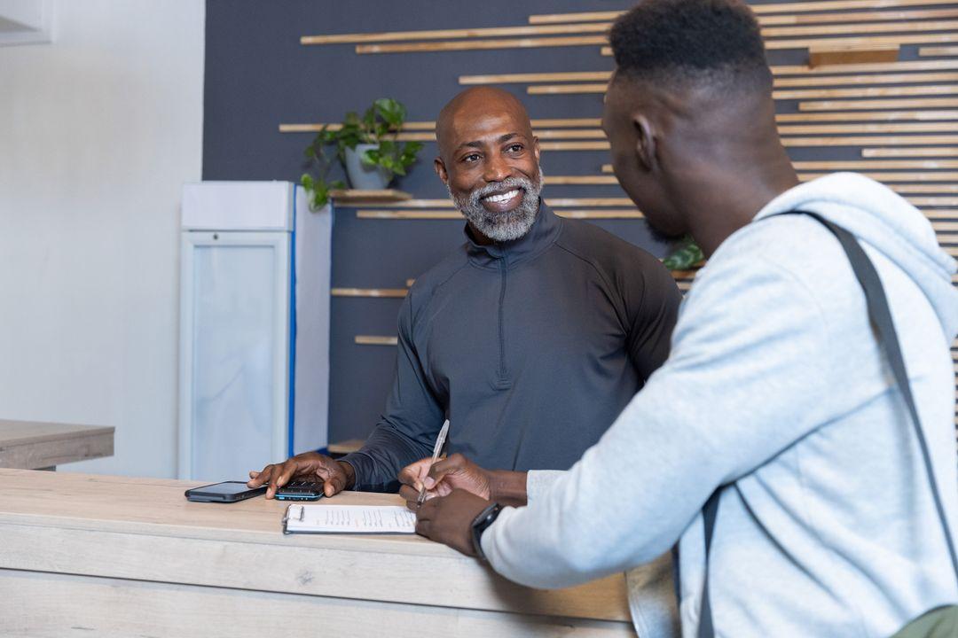 Receptionist attending to a client at the front desk
